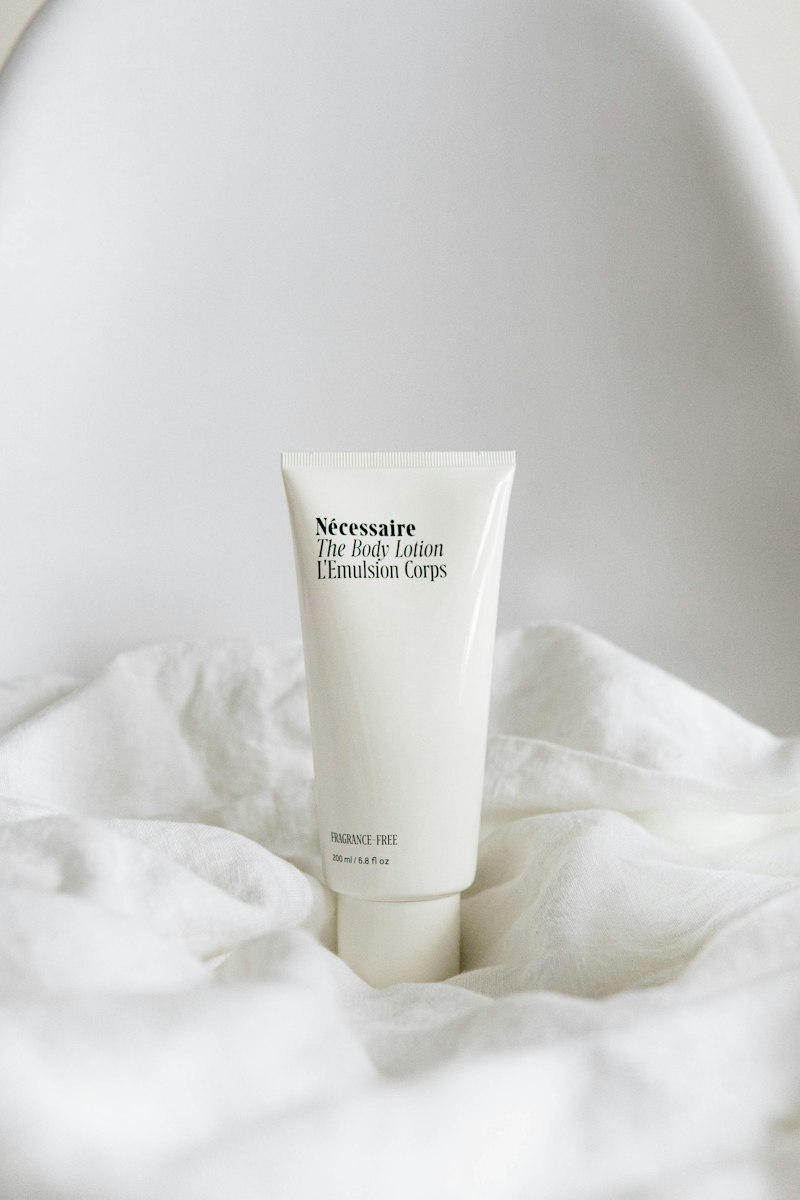 Luxury skincare dropper bottle and warm light reflections, original campaign artwork